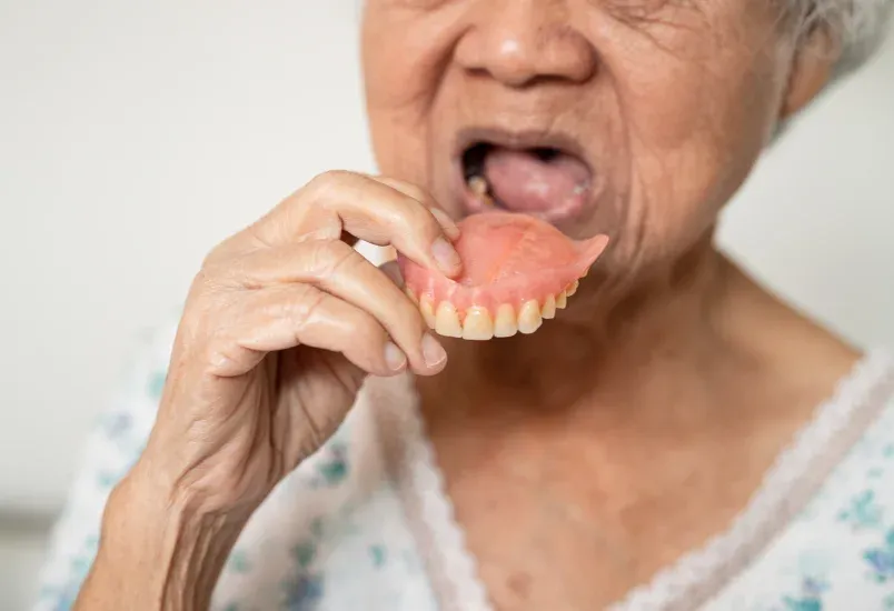 Happy patient pointing to smile